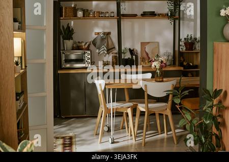 Modern Home Kitchen and Dining Area Showcasing Cozy Interior Design Stock Photo
