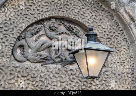Dublin Ireland - 11 Oct 24: Architectural close-up at Kilmainham Gaol in Dublin, Ireland, featuring a carved stone dragon relief and a traditional wal Stock Photo