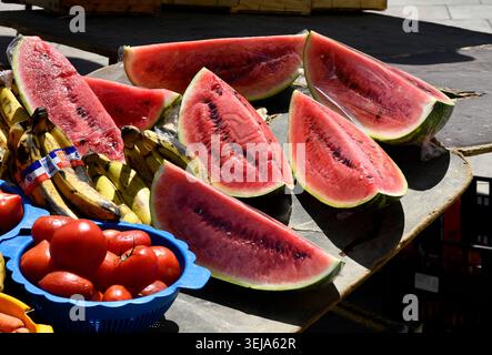Juicy fresh water melons and tomatoes on sale at outdoor market Beaucaire in Provence, France, 2026 Stock Photo