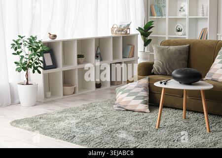 Interior of living room with green sofa and glucophone on table Stock Photo
