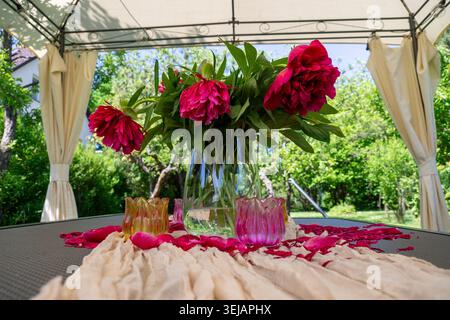 Peony Arrangements Enhance Outdoor Setting With Charming Accents Stock Photo
