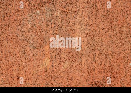 Abstract background of a weathered light blue paint coating on a metal surface with subtle orange rust specs, scratches, and vertical streaks. Stock Photo