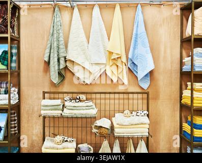 Colored terry towels on a shelf in a spa salon Stock Photo