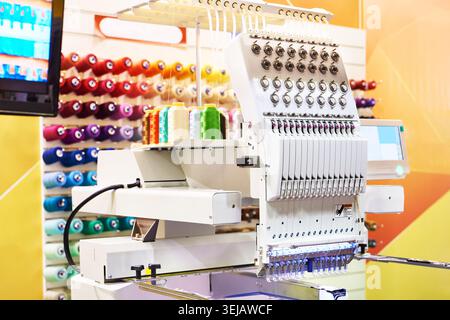 Embroidery industrial machine in sewing workshop Stock Photo