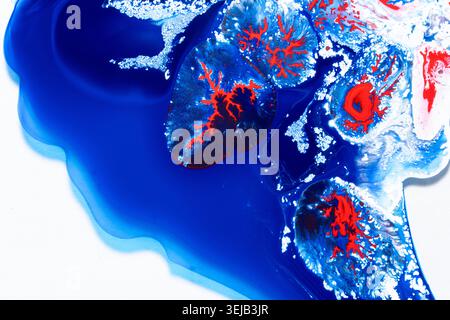 Surreal abstract artwork featuring icy blue gradients and vivid red organic forms resembling frozen planets or microscopic textures. Perfect for scien Stock Photo