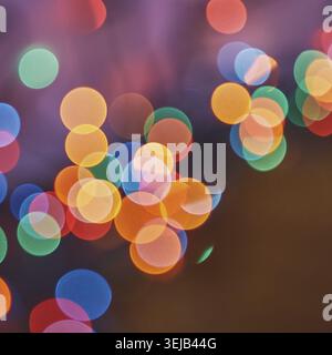 Colorful bokeh lights in soft focus creating vibrant abstract background with circular patterns Stock Photo