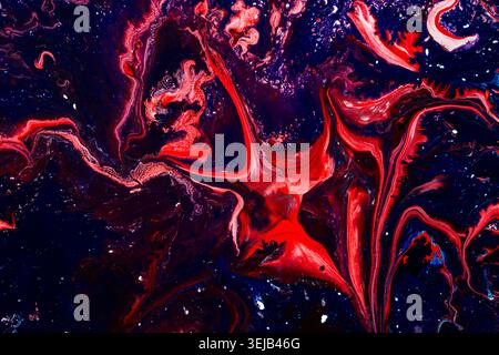 Powerful dark abstract fluid art with flowing red and blue marble textures creating dramatic movement and luxury visual depth. Suitable for premium br Stock Photo