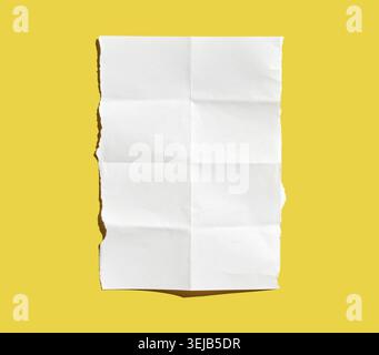 Crumpled white paper sheet on vibrant yellow background highlighting texture and contrast Stock Photo