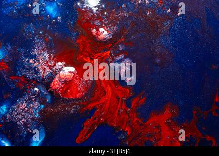 Highly detailed abstract artwork with explosive red and blue textures resembling cosmic energy, nebula formations, and fluid motion. Ideal for futuris Stock Photo