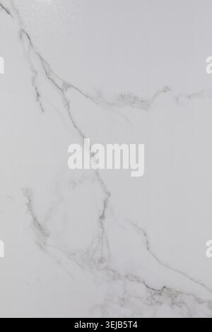 Smooth white marble with grey veins creates a stylish surface perfect for interior design. The clean texture highlights natural beauty, ideal for vari Stock Photo