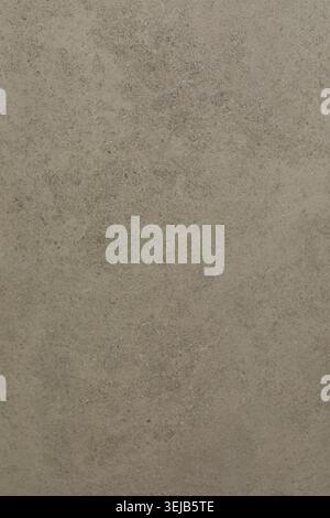 Close-up view of a rough stone surface displaying various shades of brown and grey. The natural patterns create an organic feel perfect for interior d Stock Photo