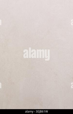 The surface showcases a light beige plaster wall with a smooth texture. Subtle variations in color and tone create an elegant backdrop suitable for va Stock Photo