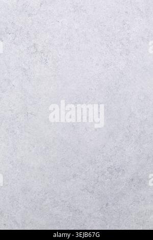 A smooth, light gray stone surface features subtle textures and patterns, perfect for various design projects, backgrounds, or crafting activities. Id Stock Photo