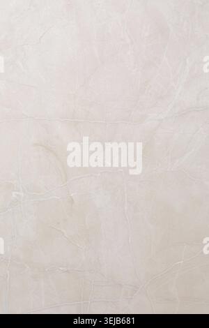 A light-colored wall features a soft, smooth surface with subtle texture, creating a calming and modern atmosphere in the interior space Stock Photo