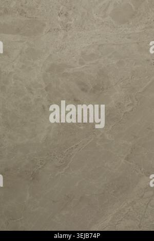 A smooth, natural stone surface features soft textures and earthy colors. This material could be used for countertops, floors, or decorative elements Stock Photo