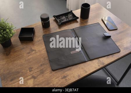 Open leather folder for documents on the desktop Stock Photo
