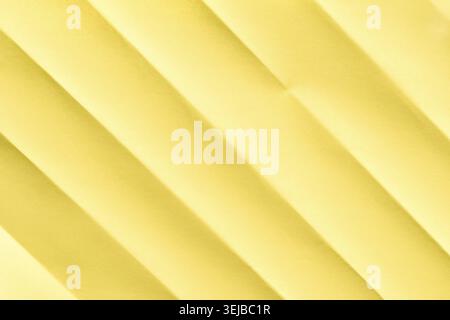 Yellow textured abstract background with diagonal lines and soft shadows Stock Photo