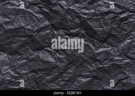 Crumpled black paper texture background for creative design and art projects Stock Photo