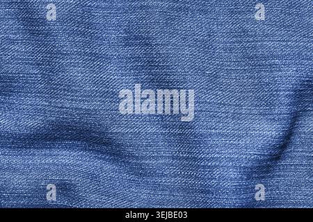 Close-up of textured blue denim fabric with detailed weave pattern Stock Photo