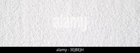 White textured wall background with subtle rough surface details for minimalist designs and projects Stock Photo