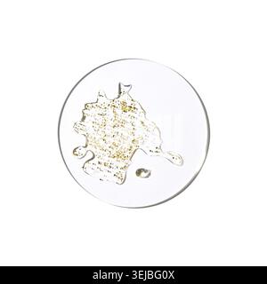 Abstract transparent liquid with gold glitter details on white circular background Stock Photo