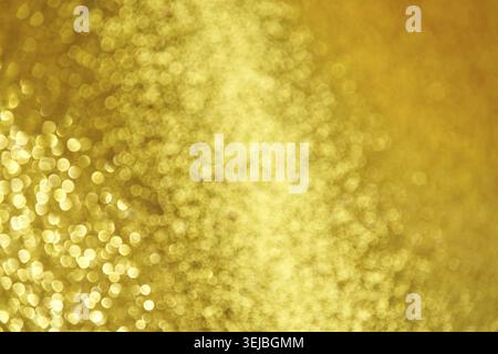Abstract golden bokeh background with soft blurred light sparkles and glittering circles Stock Photo