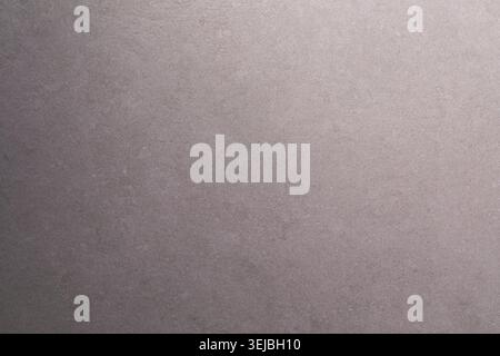 The smooth, soft beige background features gentle variations in tone, adding depth. This versatile backdrop is ideal for artistic and design applicati Stock Photo