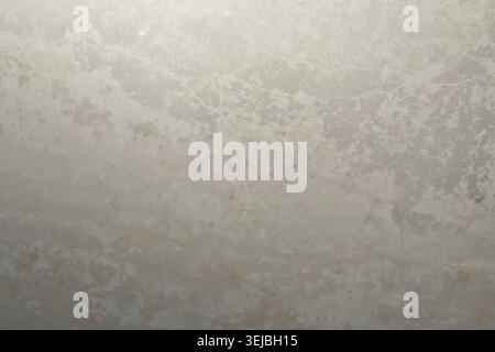 The scene showcases a smooth, textured surface of light gray stone, featuring subtle variations in color and pattern. Soft light highlights its unique Stock Photo
