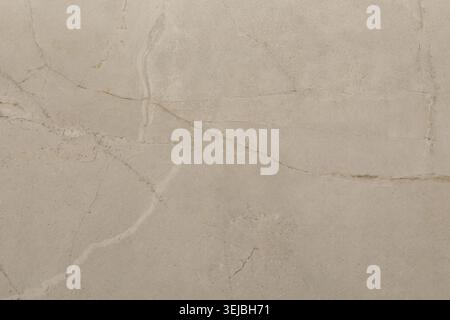 Beige marble showcases a smooth surface with delicate veins and textures, perfect for use in kitchen countertops, flooring, and wall panels. Its natur Stock Photo