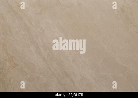 This light beige stone surface features delicate veining and textures. It is ideal for use in flooring, countertops, and other home design projects. T Stock Photo
