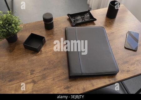 Leather folder for documents on the desktop in brown color Stock Photo