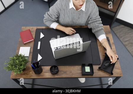 Woman working at office desk top view Stock Photo