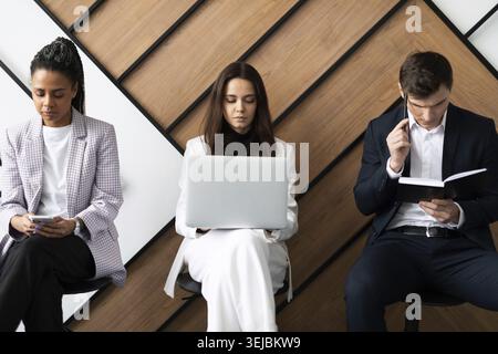 Stressful business people waiting for job interview Stock Photo