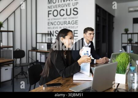 Business meeting. buiness team brainstorming while sitting at the office table together Stock Photo