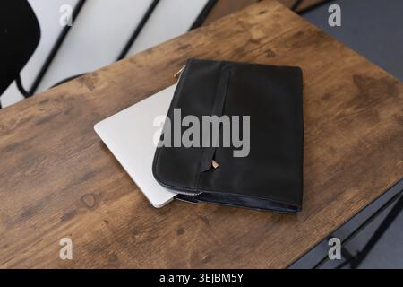 Leather folder laptop case on the table Stock Photo