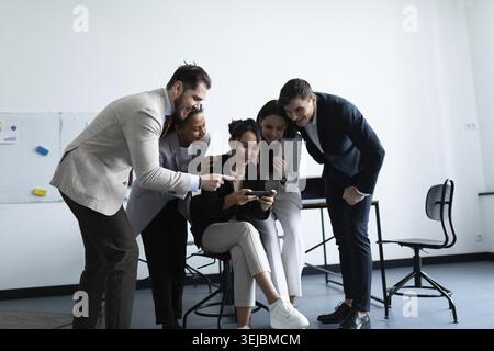 Cheerful startup business team rejoicing success at office Stock Photo