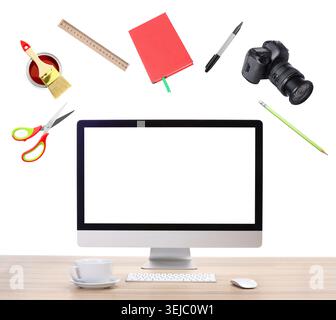 Web design tools flying around computer. Creative designer workspace Stock Photo