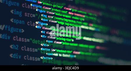 Blurred HTML and CSS web development syntax code displayed on a computer screen Stock Photo