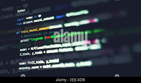 Python machine learning code with neural network syntax displayed on a dark monitor screen Stock Photo