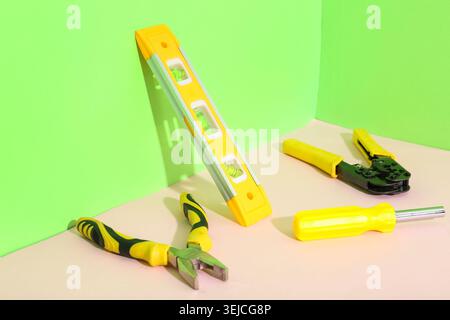 Different construction tools on color background Stock Photo