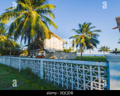 Balikpapan, Indonesia - May 21 2026. An old coastal house with unique asymmetrical mid-century modern design, known as Yankee style house. Stock Photo