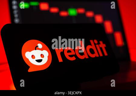 Reddit Social Media Corporation Logo Displayed On Screen With Financial Stock Chart Background And Vibrant LED Lighting Stock Photo