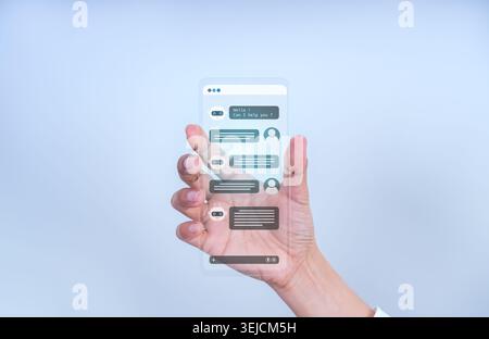 Hand holding future glass phone with chatbot interface for conversational AI and automated customer support. Concept of virtual assistant, smart commu Stock Photo