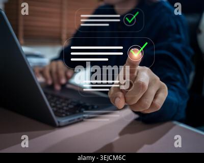Businessman using digital approval interface for online verification, workflow automation and task completion on laptop. Quality control, checklist ma Stock Photo