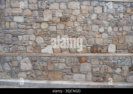 Stone wall made of different shapes and sizes Stock Photo