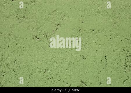 Close Up of Light Green Rough Textured Wall Stucco Background Stock Photo