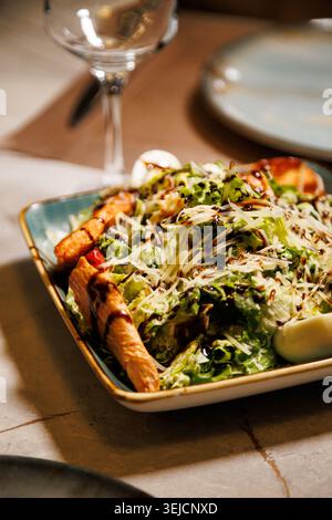 Fresh Caesar Salad with Grilled Chicken Parmesan Cheese and Balsamic Dressing Stock Photo