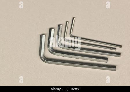 Five assorted allen wrenches flat lay on white background fastening tools. Stock Photo