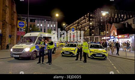 Cheshire Police prepare for Warringtons Saturday night-time pubs & clubs alcohol drinking economy as revellers leave pubs & bars around Bridge Street. Stock Photo