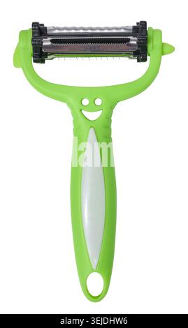 Green plastic vegetable peeler on isolated background Stock Photo